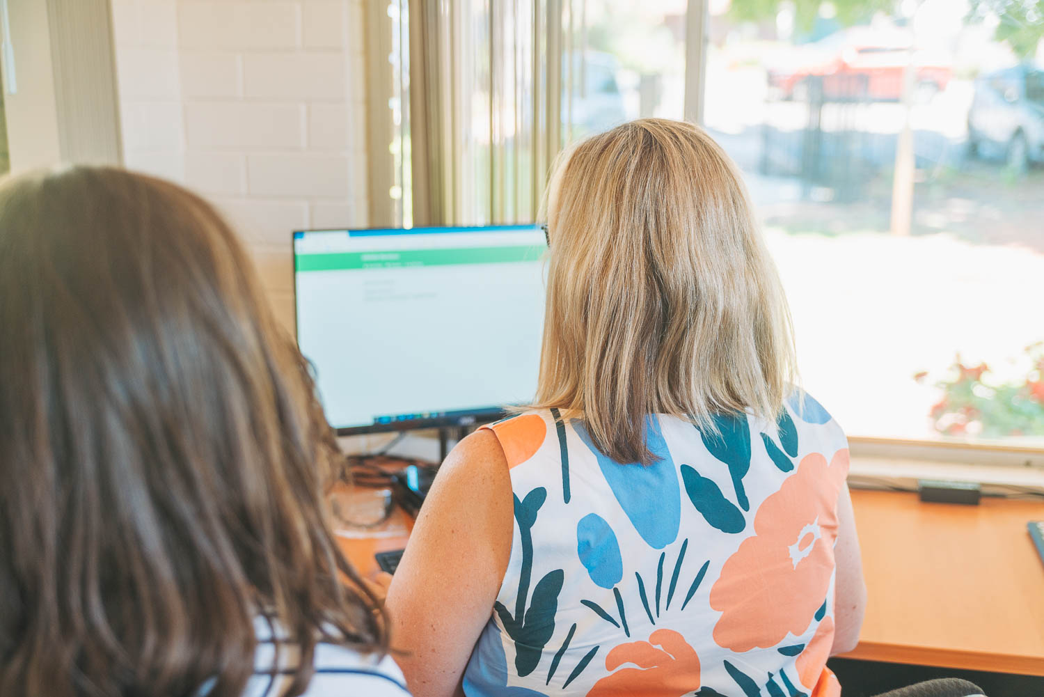 Grandmother being assisted to access services online